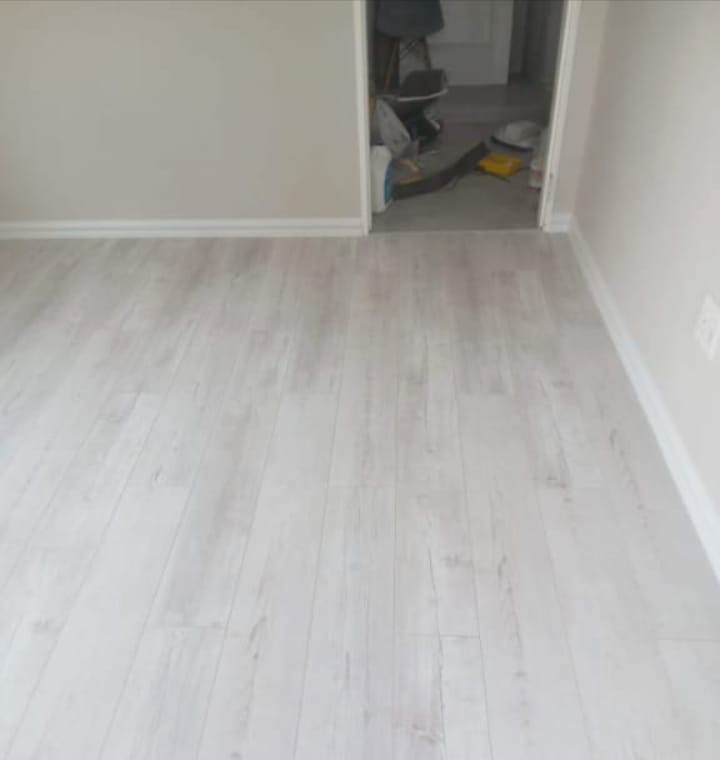 Light wood-look flooring installed in a freshly finished room