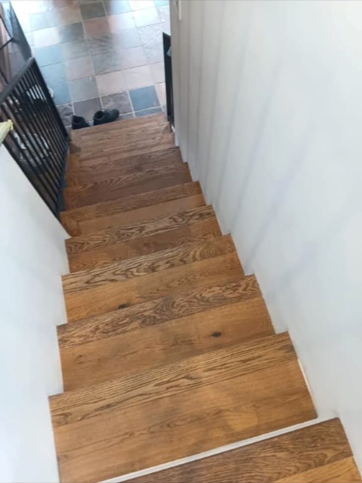 Completed wooden staircase viewed from the upper landing